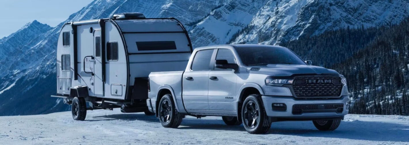 A Ram truck towing a camper